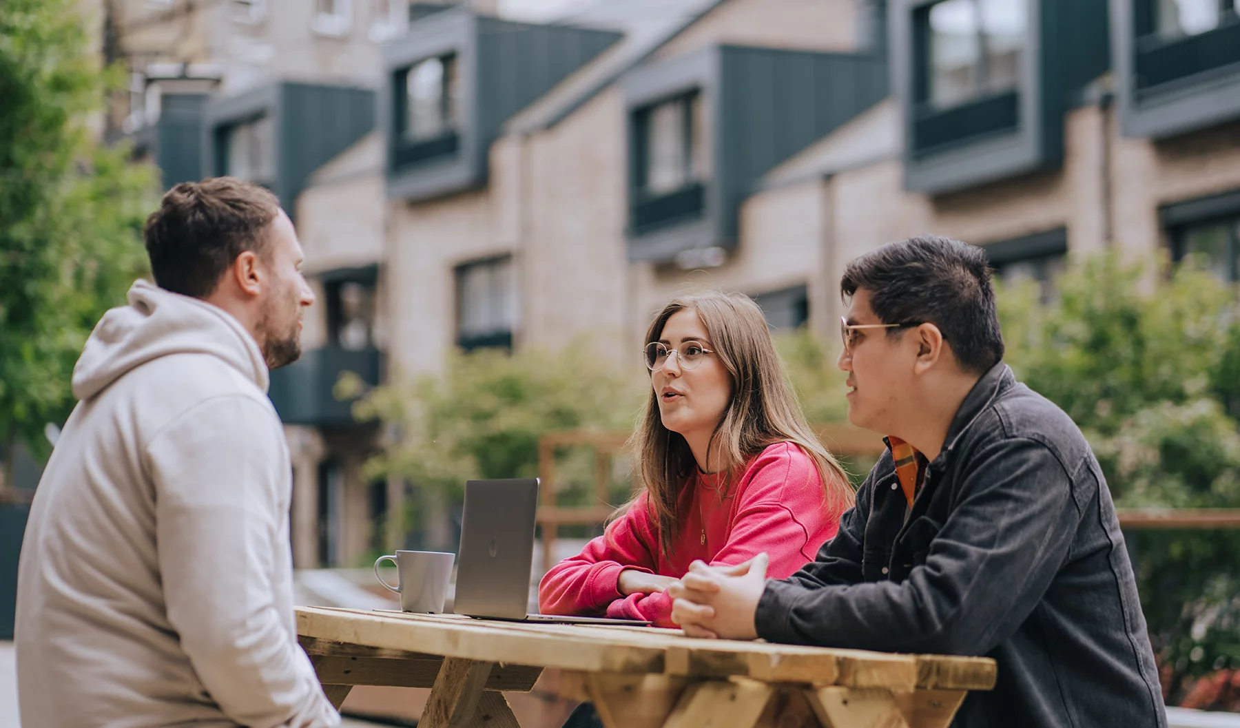 Team discussing outside